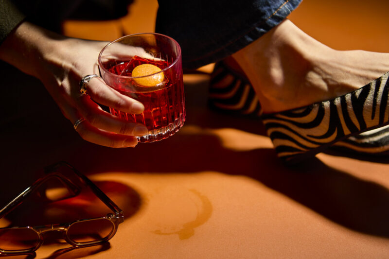 Shoes next to negroni